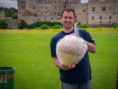 Glenn from LoveFireworks holding a large shell firework at Leeds Castle